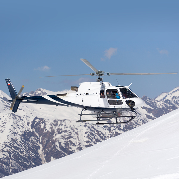 snowy mountain transfer helicopter